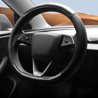 Hybrid carbon fiber Tesla steering wheel cover showing glossy weave and red accents on Model Y interior